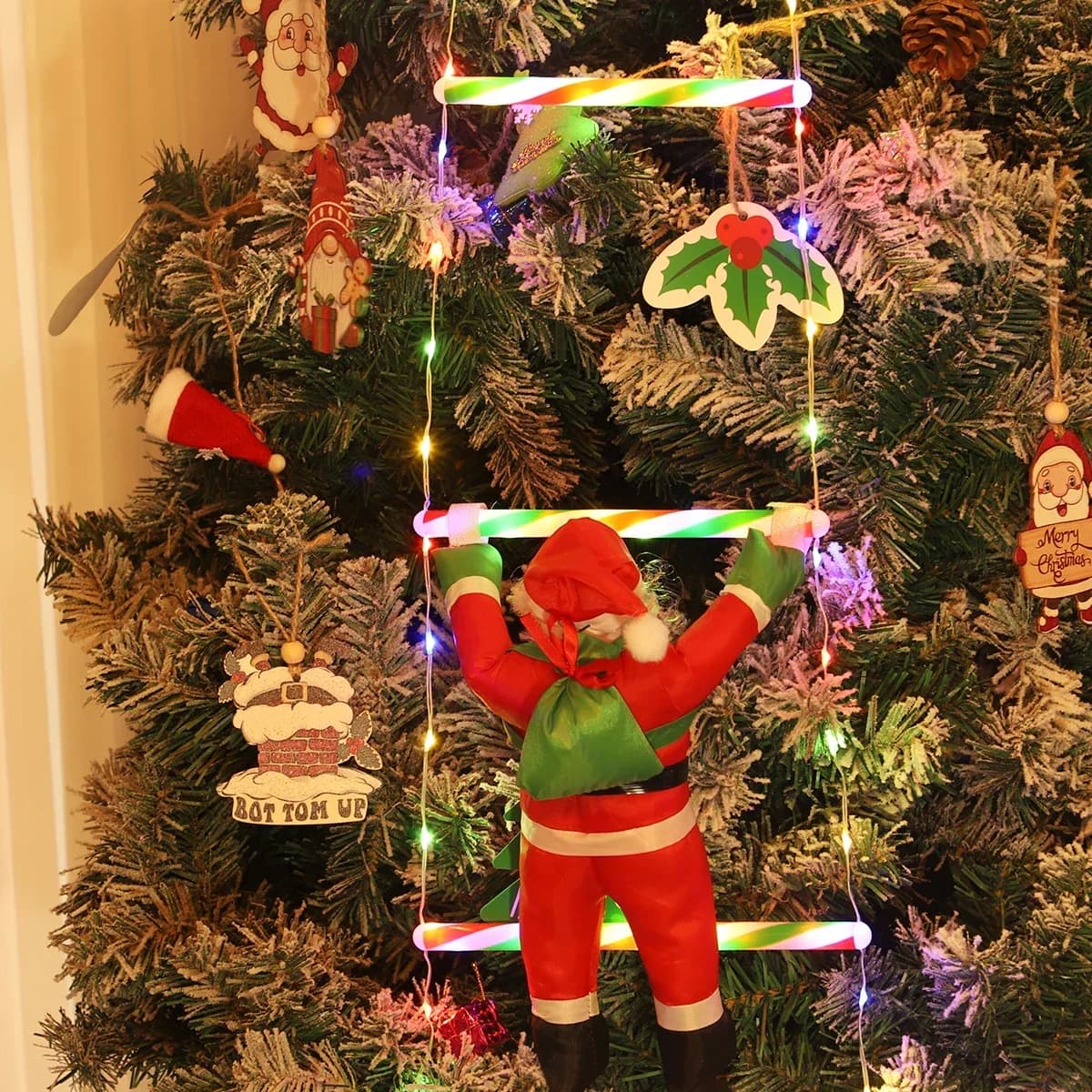 Santa lezoucí po žebříku Vícebarevné LED světelné řetězy